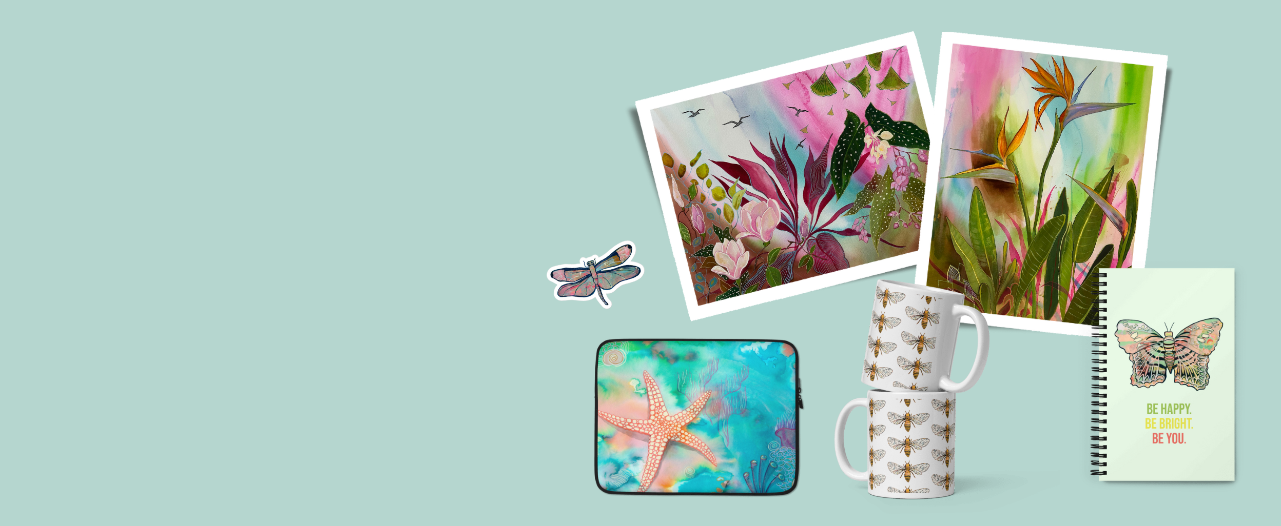Home page banner showcasing Aquamarine Design Studio's unique offerings: Fine Art Prints, Stickers, Greeting Cards, Journals, Phone Cases, Pillows, Placemat Sets, Puzzles, Laptop Sleeves, Mugs & Tumblers, Tote Bags, all set against an aquamarine blue background, embodying harmony in art and reflecting nature-inspired themes and sustainable art practices. All Art by Artist Aquamarine Design Art and Gifts by Artist Tania Herrera from California.